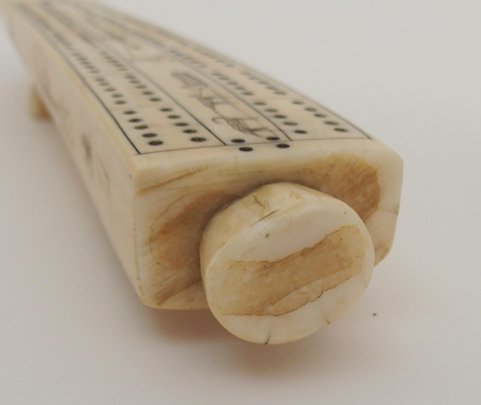 AN INUIT WALRUS TUSK CRIBBAGE BOARD the top with twelve pierced marker sections, divided by Eskimos, - Image 6 of 6