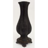 A CHINESE BRONZE QUATREFOIL LOBED VASE set on a fixed base with scroll feet, 35.5cm high, 2.9