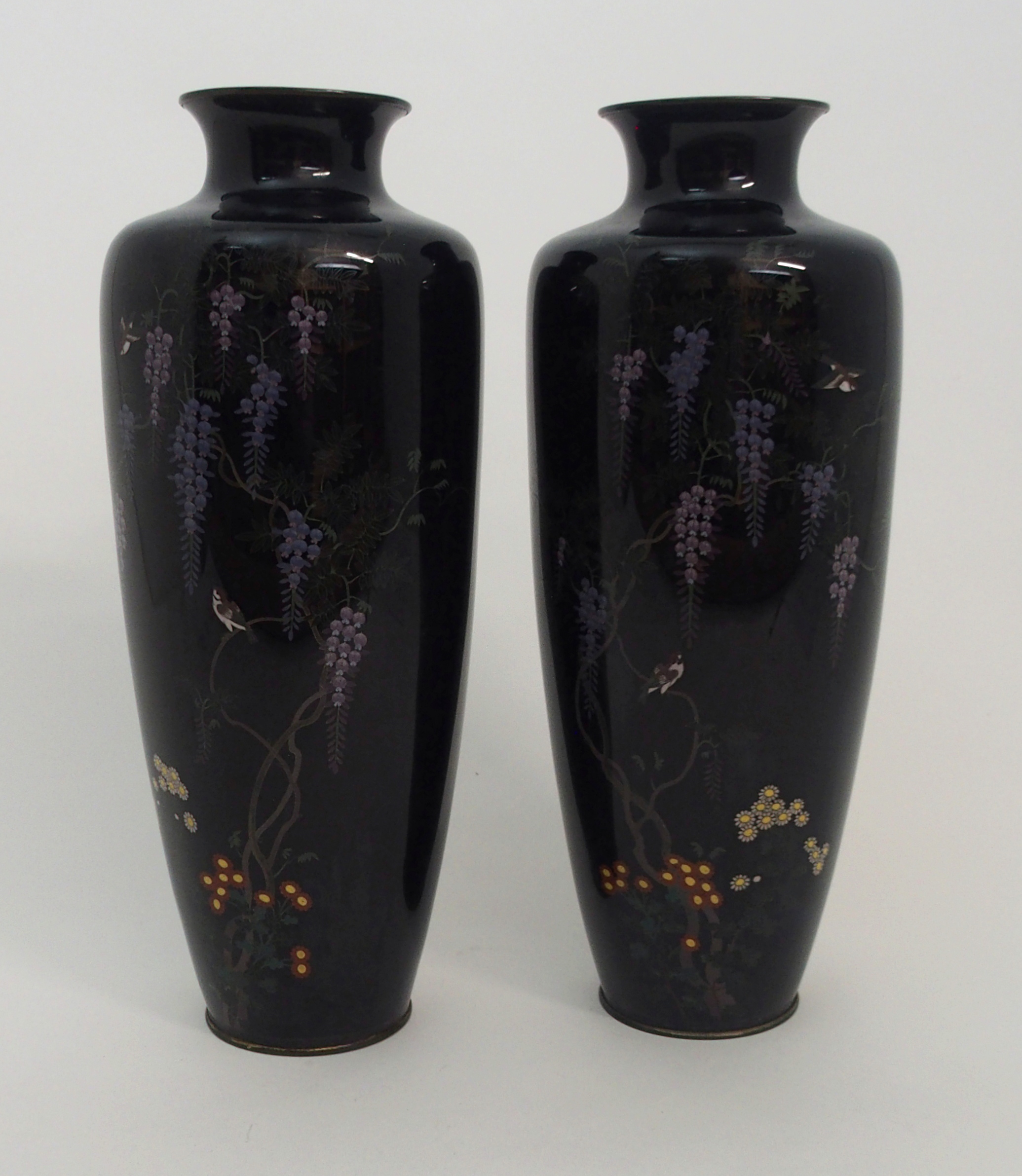 A PAIR OF JAPANESE CLOISONNE BALUSTER VASES decorated with birds amongst wisteria and above