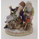 A MEISSEN FIGURE OF WINTER modelled as a boy seated upon a sledge holding an axe beside a girl