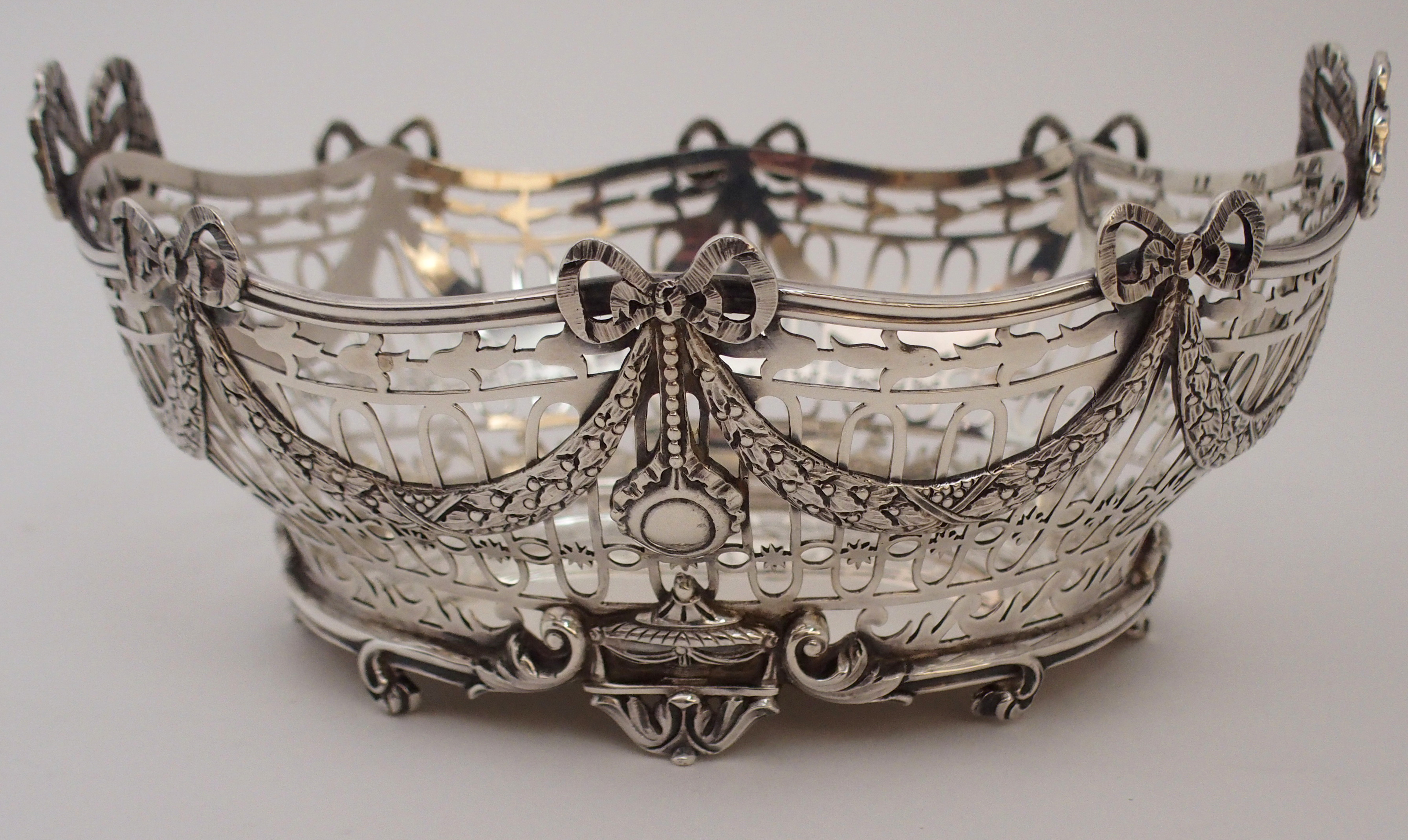 A SILVER BASKET by C. S. Harris & Sons Limited, London 1912, of oval form, the open strapwork body - Image 3 of 8