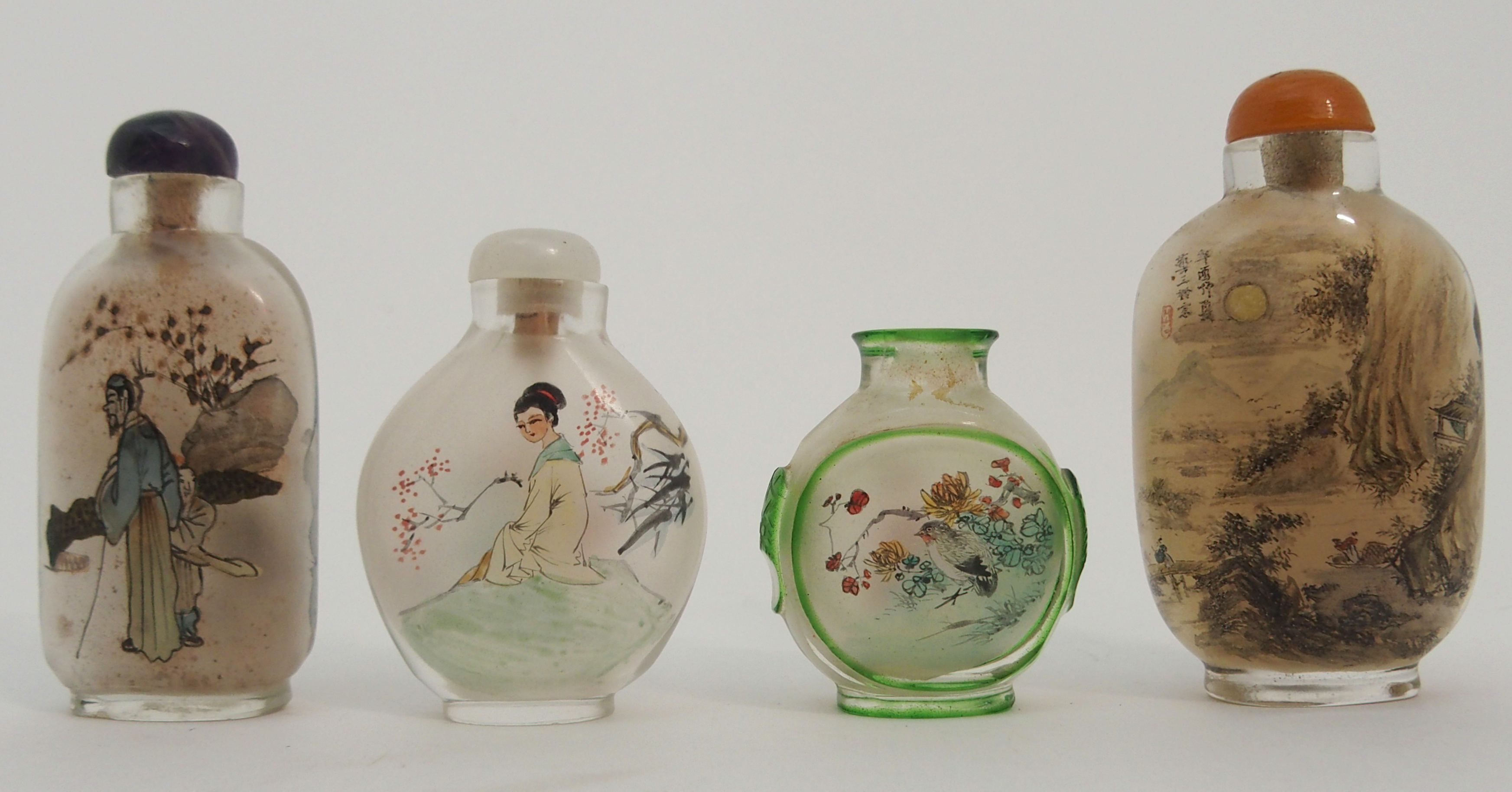 FOUR CHINESE DECORATED GLASS SNUFF BOTTLES one with a river landscape, scholar and attendant, 7cm - Image 2 of 3