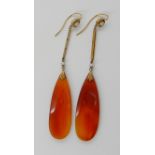 A PAIR OF 15CT GOLD ART DECO LONG DROP CARNELIAN EARRINGS further set with pearls. Length of drops
