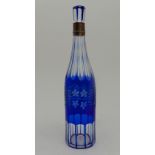 A 19TH CENTURY BLUE FLASHED AND CUT GLASS DECANTER with vine etched decoration, with silver