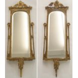 A PAIR OF 19TH CENTURY GILT WOOD AND GESSO WALL MIRRORS with foliate scroll surmounts above