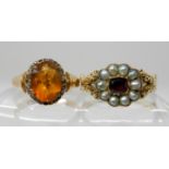 TWO VICTORIAN RINGS a yellow metal red gem and pearl flower ring, with pierced shoulders with