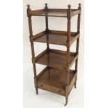 A VICTORIAN ROSEWOOD WHAT NOT with knop finials above four shelves and a single base drawer joined