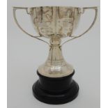 *WITHDRAWN* A SILVER TROPHY CUP ON STAND by James Wood & Sons, Birmingham 1908, of circular form