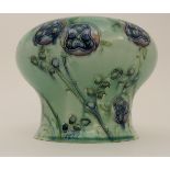 A WILLIAM MOORCROFT FOR LIBERTY TUDOR ROSE PATTERN VASE of waisted form decorated with tubelined