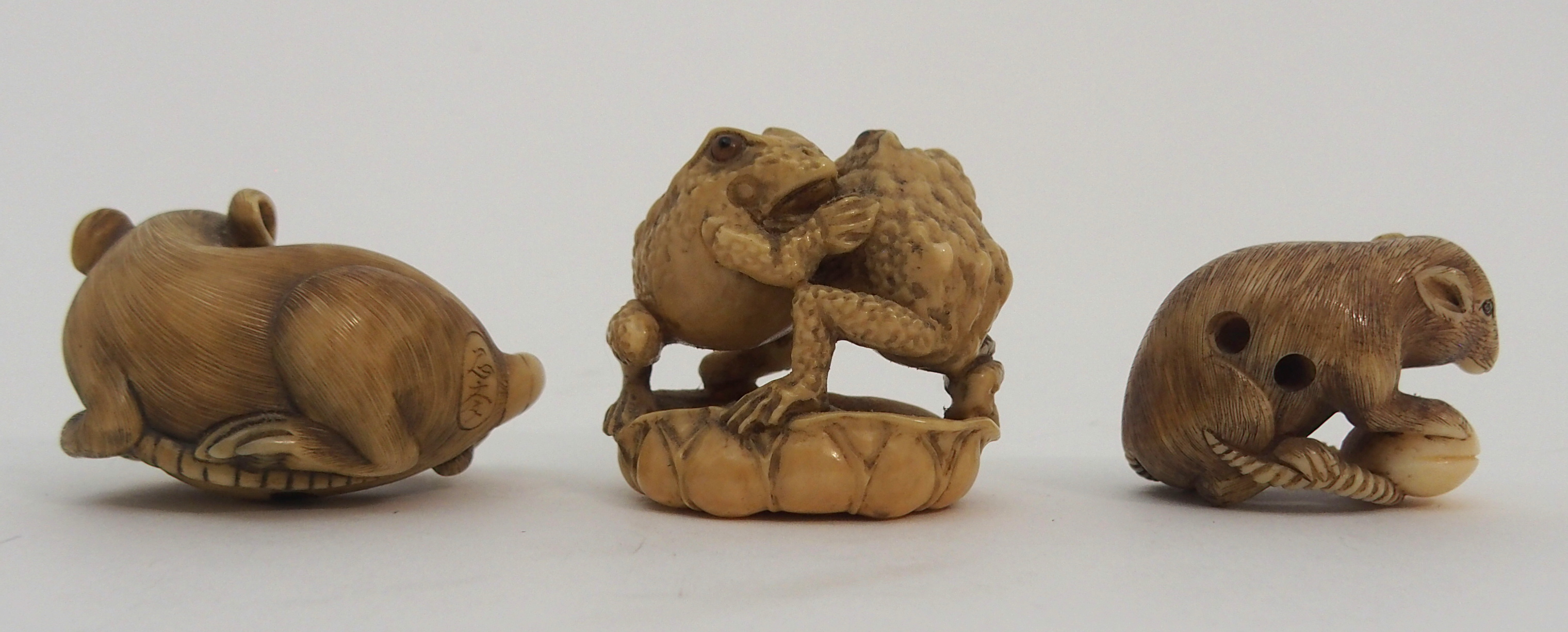 THREE JAPANESE IVORINE NETSUKE one as a rat holding a nut, signed, 3cm high, another chewing tail, - Image 2 of 7