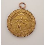 A RARE 9CT GOLD LONDON FLOODLIGHT FOOTBALL MEDAL the obverse inscribed London Floodlight Football,