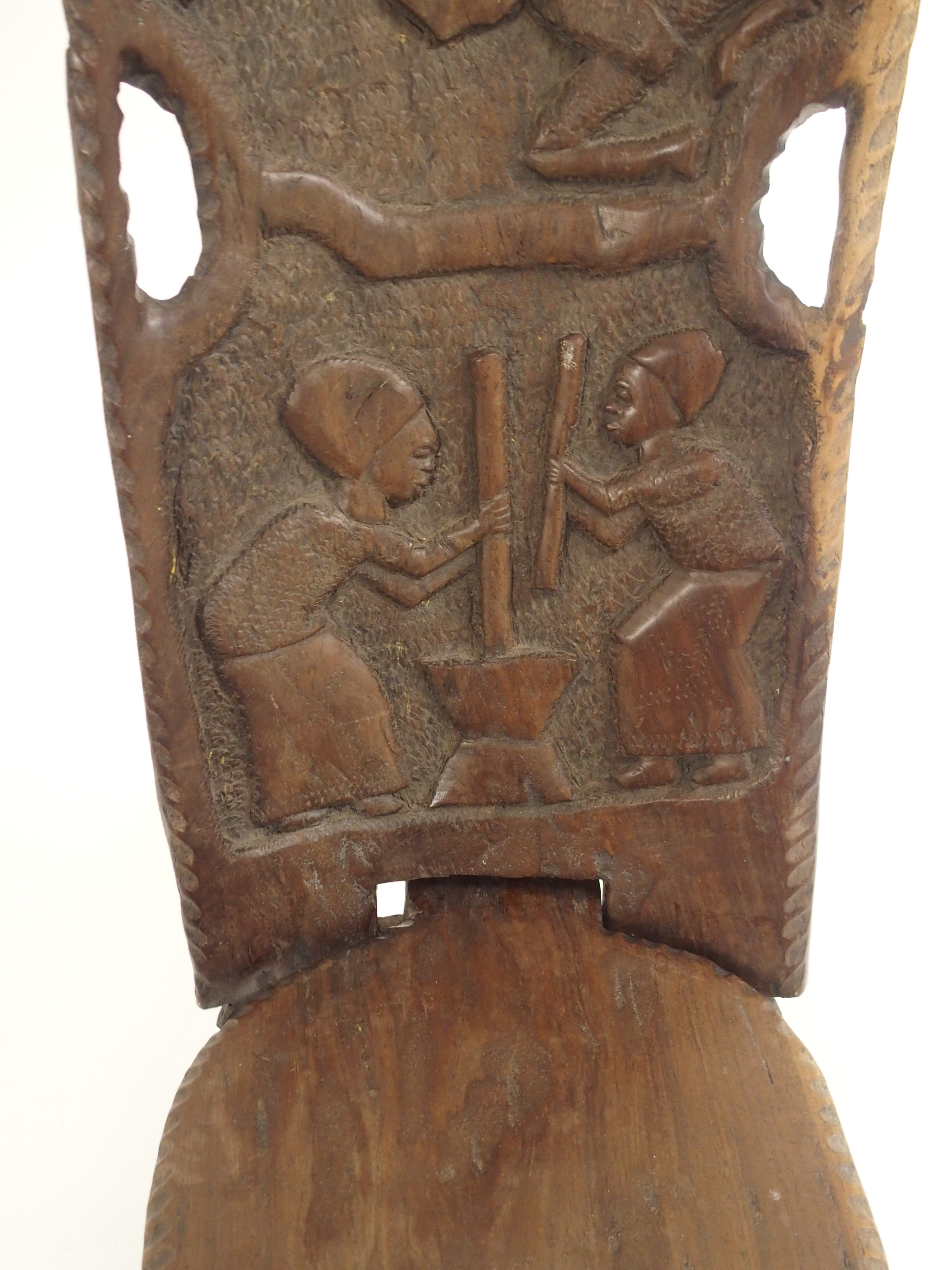 AN AFRICAN CARVED BIRTHING CHAIR the back with face mask flanked by two figures, above two women - Image 10 of 11