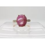 A 9ct gold star ruby and diamond accent ring, size O, weight 4gms Condition Report: