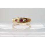An 18ct gold ruby and pearl ring, dated 1895, size M1/2, weight 2.8gms Condition Report: Available