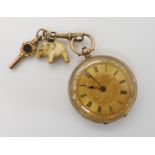 A yellow metal open face fob watch with gold coloured decorative dial and blued steel hands with