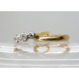 An 18ct gold three stone diamond ring set with estimated approx 0.20cts of diamonds, size S1/2,