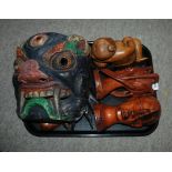 Three trays of various tribal masks etc Condition Report: Available upon request
