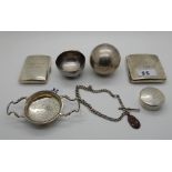 A lot comprising two silver cigarette cases, a small bowl, a pill box, a watch chain, a bowling