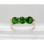A 9ct gold Russian diopside and diamond ring size P1/2, weight 1.2gms Condition Report: