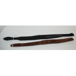 A brown leather Lochgelly by John. J. Dick and a leather tawse by Stevenson (2) Condition Report: