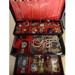 A gold plated white metal Greek key pattern bangle, and a box full of costume jewellery Condition