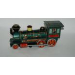A Japanese tin plate locomotive various other tin plate toys Condition Report: Available upon