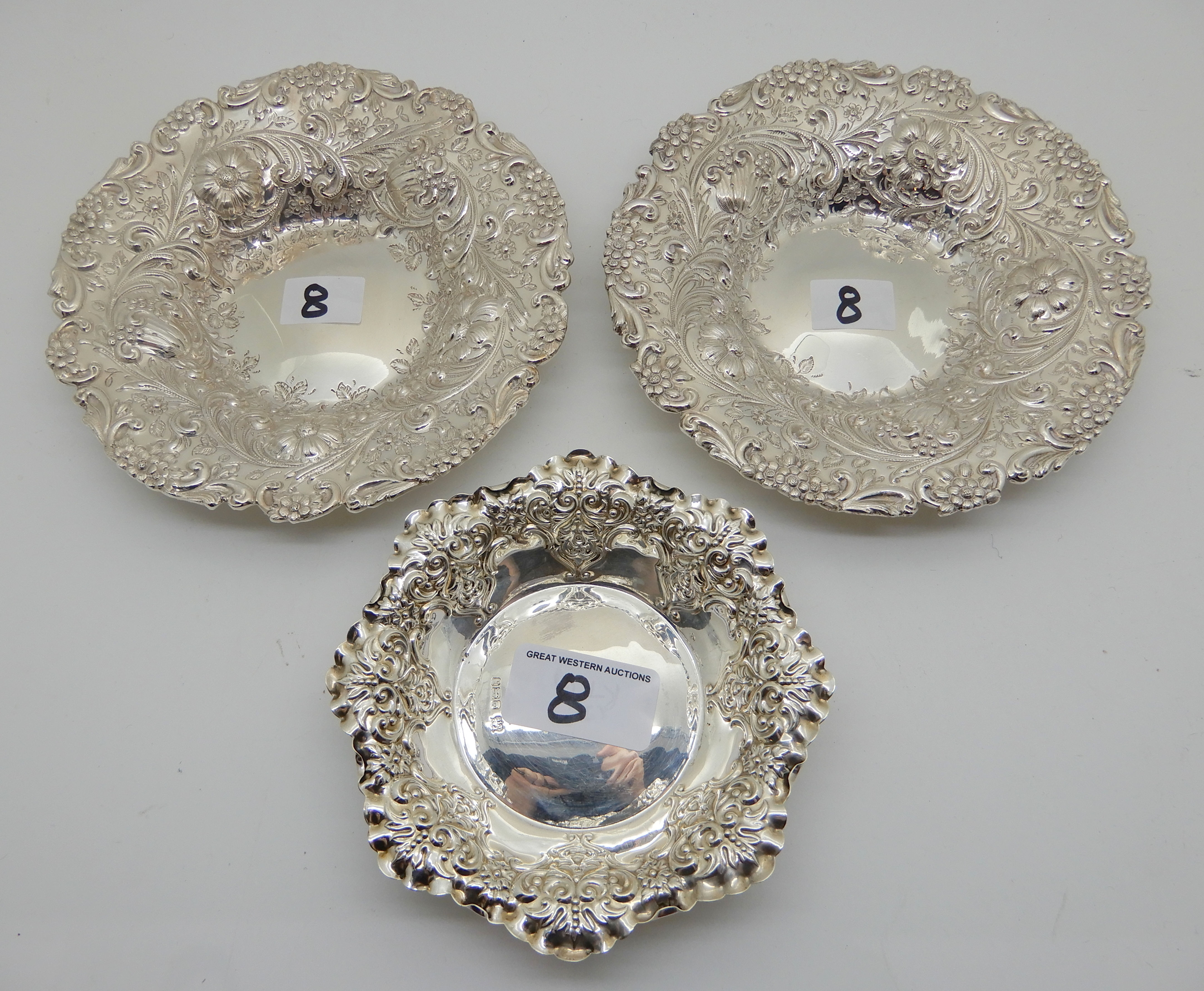 A lot comprising a pair of silver bon bon dishes, London 1895,15cm diameter and a single bon bon