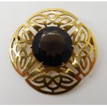 A 9ct gold Ward brothers Celtic knotwork brooch set with smoky quartz, diameter 3.8cm, weight 7.5gms