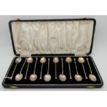 A cased set of twelve silver seal-top coffee spoons, Birmingham 1939, 101gms Condition Report:
