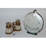 A pair of mother of pearl vintage opera glasses and a mother of pearl carved nativity scene and