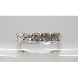 An 18ct white gold five stone diamond ring, estimated approx combined diamond content 0.80cts,
