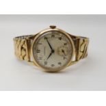A 9ct gold cased gents Garrard watch with gold plated strap. Hallmarked Birmingham 1963 Condition