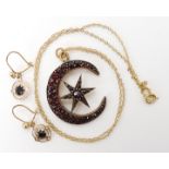 A yellow metal garnet set crescent moon and star pendant together with a pair of 9ct gold garnet