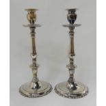 A pair of silver plated candlesticks, 29cm high Condition Report: Available upon request