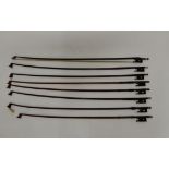 A lot of eight violin bows, varying sizes 66cm, 72cm etc (af) Condition Report: Available upon