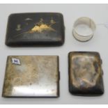 A lot comprising a silver cigarette case, a white metal case, a Japanese case and a silver napkin