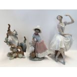Three Lladro groups including a seated ballerina, a squirrel and a girl leaning on a wall