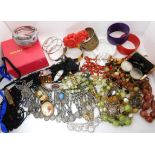 A large Ethnic coin style necklace, a Butler & Wilson crocodile bangle, vintage perfume bottles