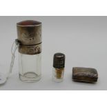 A lot comprising two small silver mounted scent bottles and a silver vinaigrette (rubbed marks)