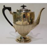 A silver coffee pot, Birmingham 1894, of tapering oval shape with half ribbed body, 24cm high,