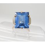 A 9ct gold Art Deco ring set with a blue glass gem, size M, weight 5.7gms Condition Report: