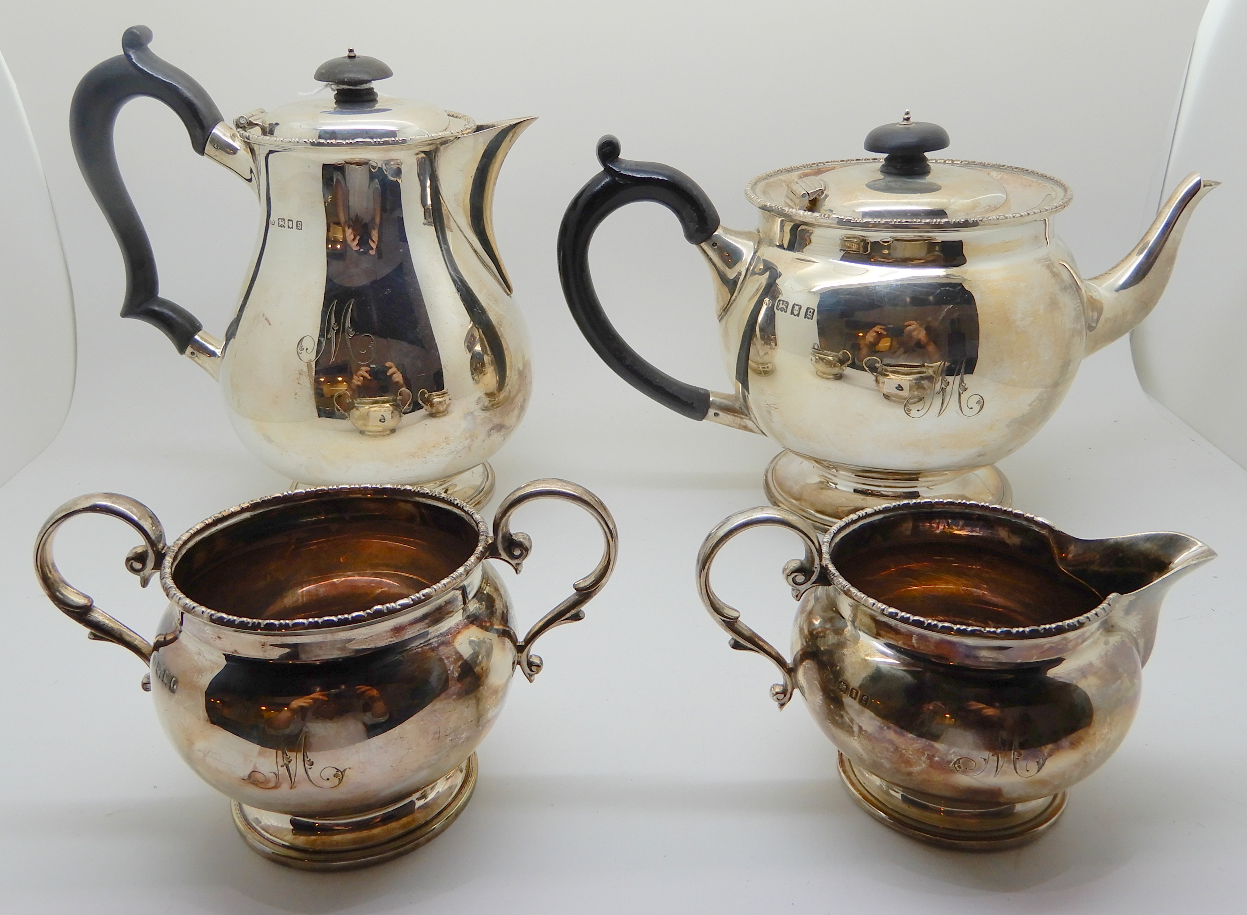 A four-piece silver tea service, London 1902, of baluster shape with gadrooned borders, each piece