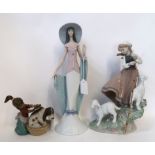 Three Lladro figures including a girl and lambs, 6964, a lady 6213 and another of a girl giving a