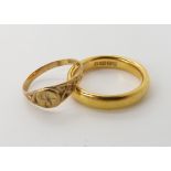 A 22ct gold court wedding ring size M1/2, weight 6.4gms and a 9ct signet ring size H1/2 weight 0.