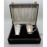 A cased silver sugar castor with near matching cream jug, Birmingham 1938 and 1939, 240gms Condition