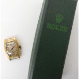 An 18ct gold cased Rocail watch head weight without mechanism but with the 'glass' 5.4gms,