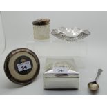 A lot comprising a silver bon bon dish, photo frame, teaspoon, cigarette box and a jar Condition