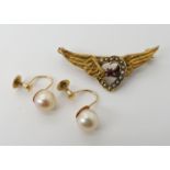 A 15ct gold winged heart brooch set with pearls and a ruby, length 4cm, weight 3.3gms together