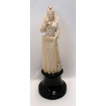 A late 19th/early 20th Century continental ivory figure of an Elizabethan lady holding a bird on her