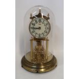 A Kundo anniversary clock under glass dome Condition Report: Available upon request